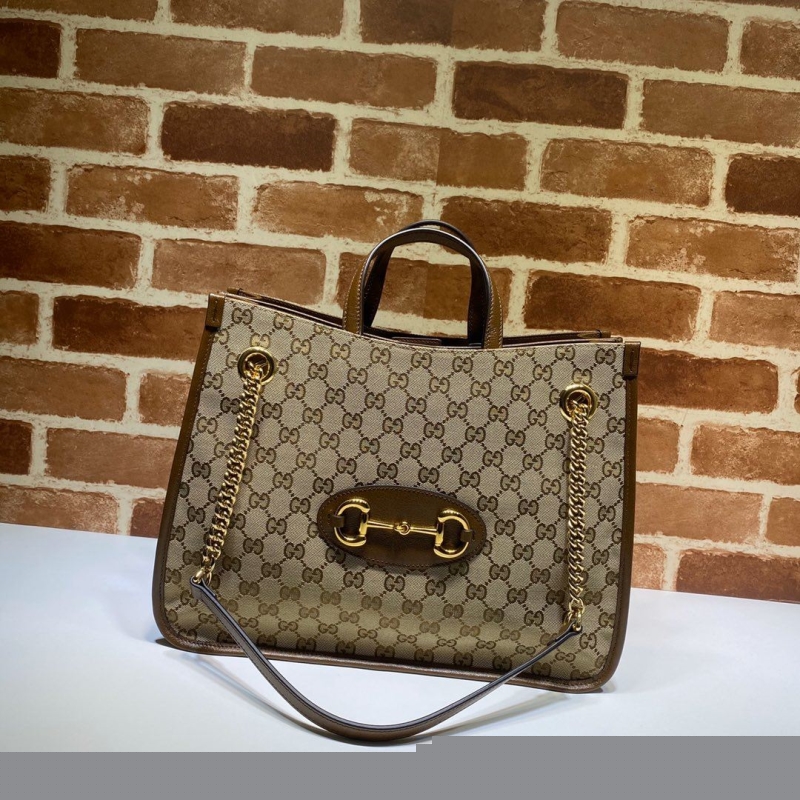 G*u*i shopping bags